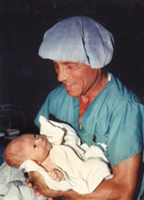 collins Dr. Collins holding baby 1 lightened